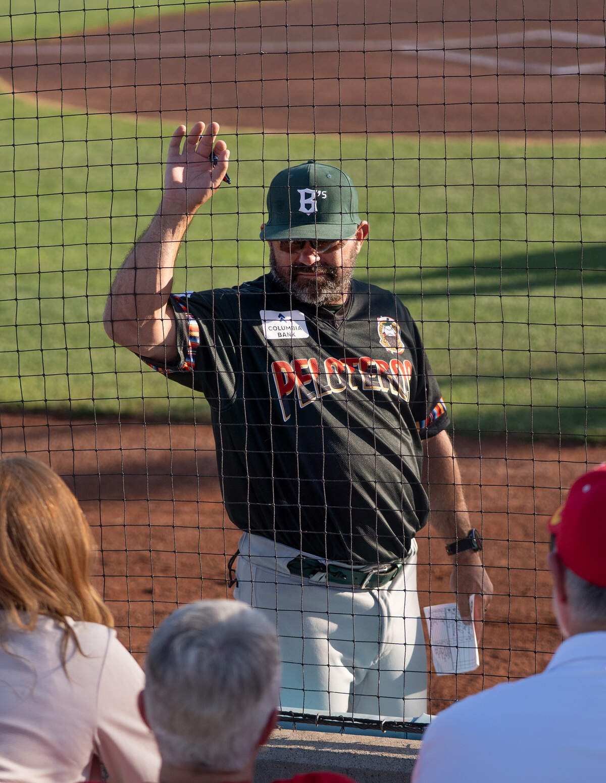 Oakland Ballers manager Aaron Miles talks with Ballers fans before a game against the Modesto Roadsters at Modern Woodmen Field in Modesto on Friday, July 3, 2026.